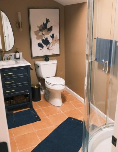 Renovated bathroom with blue and brown accents - interior designer Windham NH