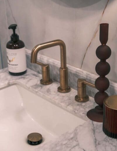 Bathroom sink with bronze details - interior designer Goffstown NH