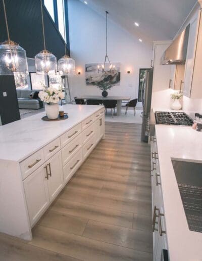 Open concept kitchen with isle green and white - interior designer Groton MA