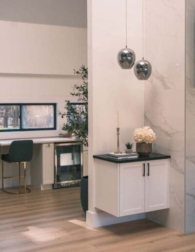 Little corner with decorative cabinet and hanging lamps - interior designer Pepperell MA