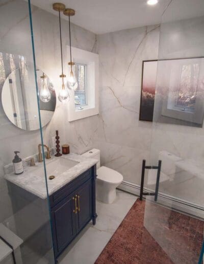 Modern bathroom with white and blue details - interior designer Bedford NH