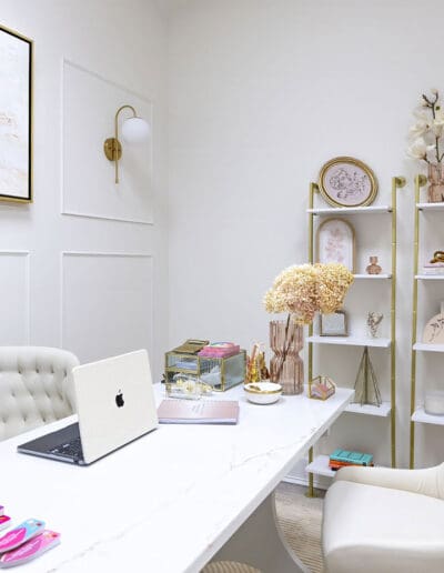 Modern white scheduling area with white desk and chairs - interior designer Nashua