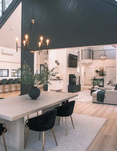 Modern dining room with open concept green and white - interior designer Litchfield NH