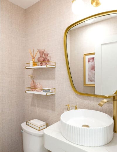 Modern pink and white bathroom with golden accents - interior designer Manchester NH
