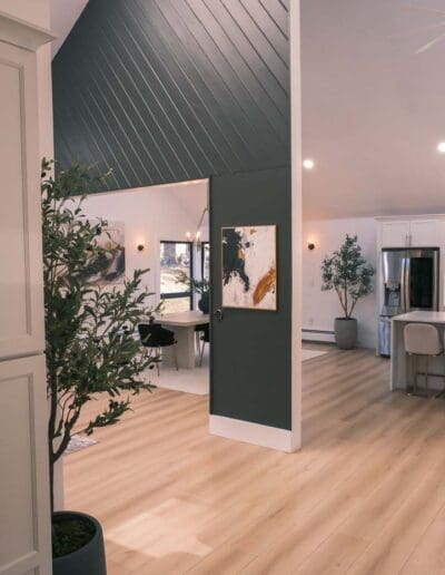 Living space with accent wall and plant - interior designer Bedford MA