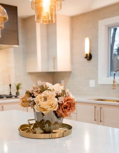 Closeup to flowers in the middle isle of the kitchen - interior designer Lowell MA