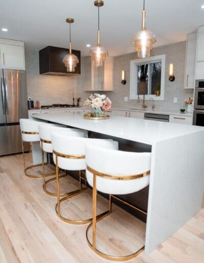 Modern kitchen with isle in the middle in studio lighting - interior designer Amherst