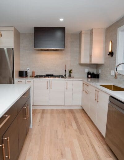 Inside open concept modern kitchen with golden accents - interior designer Portsmouth NH