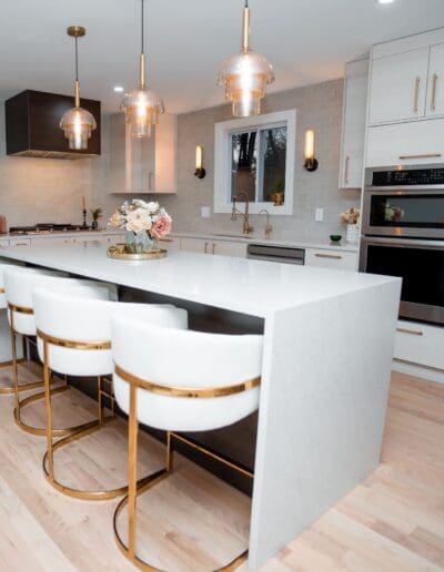 Modern kitchen with isle in the middle in natural lighting - interior designer Amherst NH